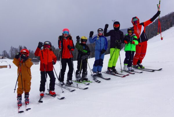Young skiers and instructor posing for the camera ou are superb friendly slopes in Hinterstoder